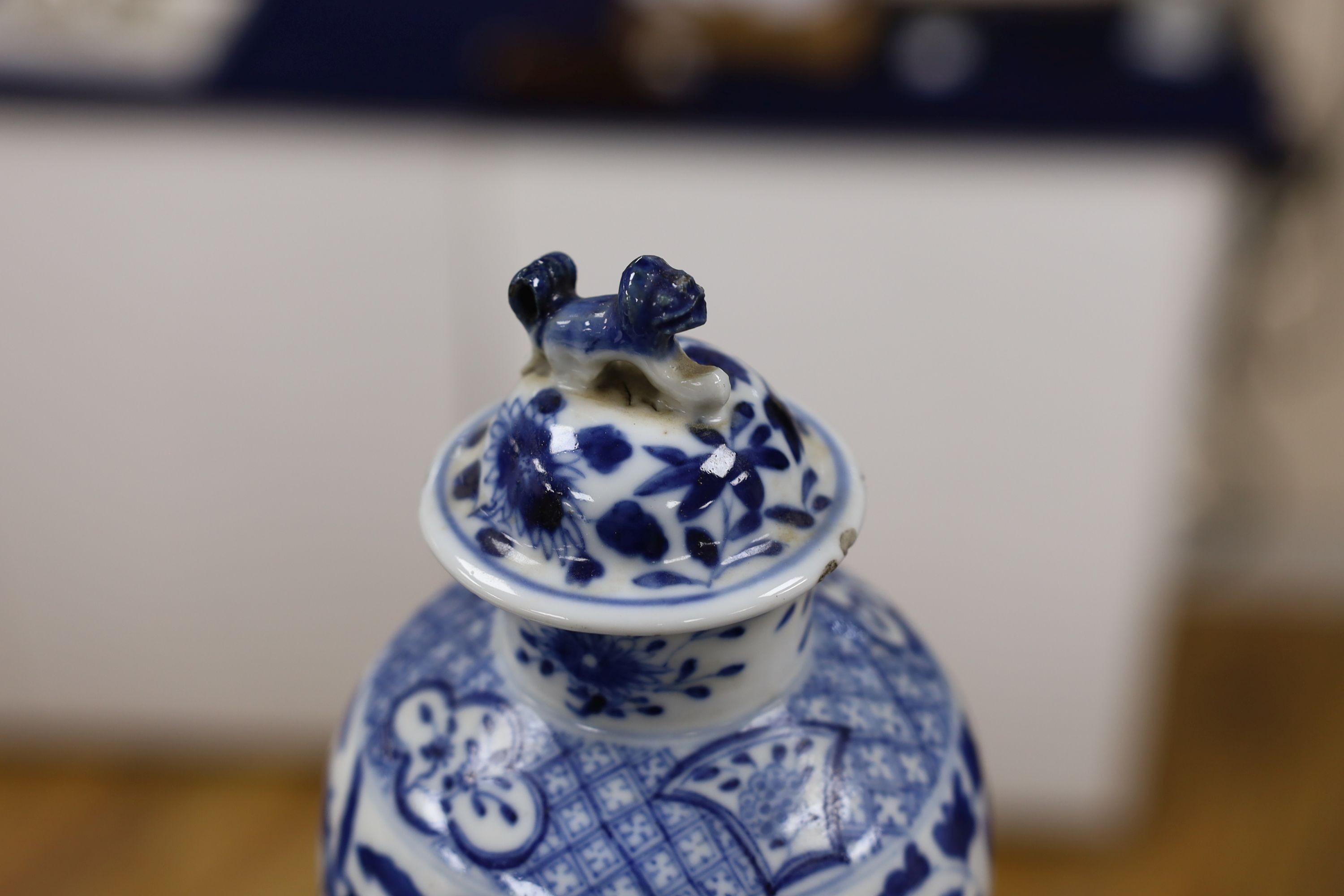 A pair of Chinese blue and white dragon vases and covers, circa 1900. 28cm